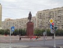Statue of Peter the Great in front of Soviet era apartment buildings
